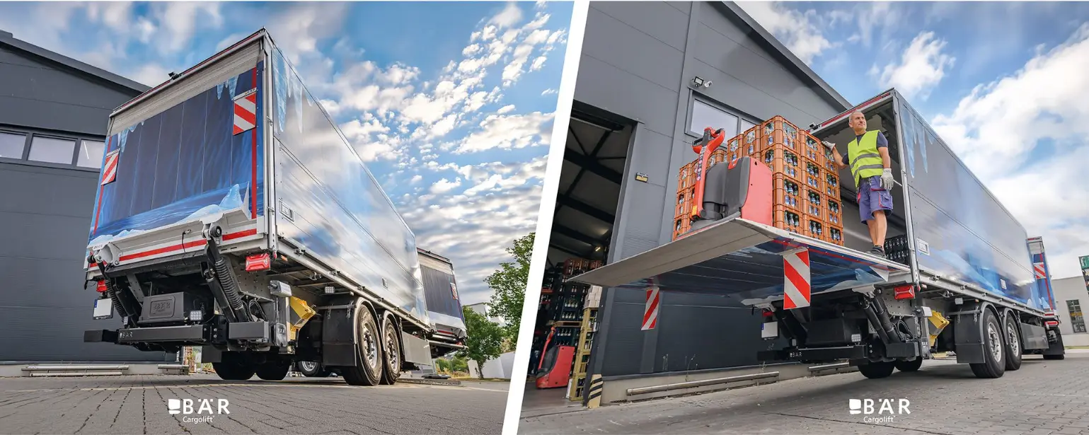 Déchargement de palettes de boissons à l'aide d'un transpalette, via un hayon Bar Cargolift monté à l'arrière de la semi-remorque d'un ensemble articulé